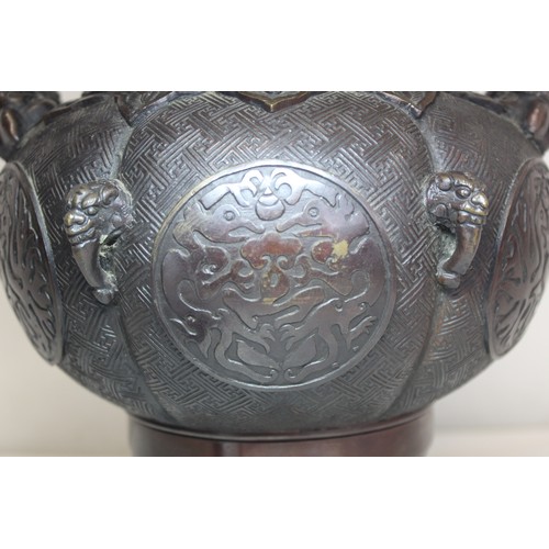 247 - Large Japanese Meiji period bronze Koro of twin handled lobed globular form with archaic circular pa... 