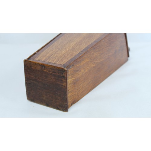 201 - Georgian oak hanging candle box of tapered rectangular form with pierced fret cut back, sloping hing... 