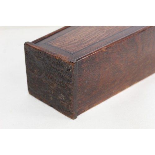 203 - Georgian oak hanging candle box of tapered rectangular form with shaped back, sloping hinged lid, ma... 