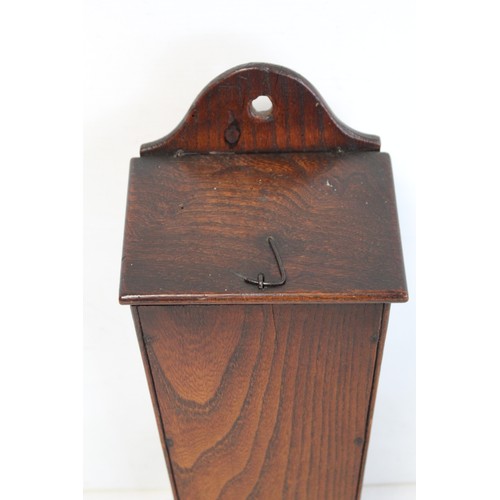 205 - Georgian elm hanging candle box of tapered rectangular form with arched pierced box, sloping hinged ... 