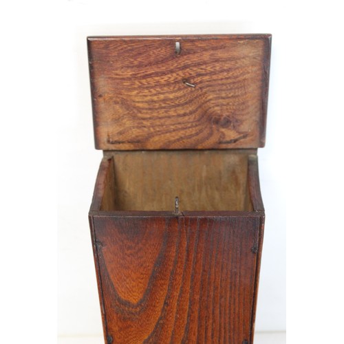 205 - Georgian elm hanging candle box of tapered rectangular form with arched pierced box, sloping hinged ... 