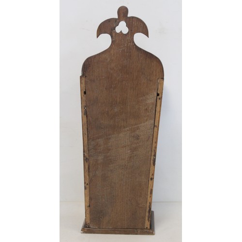 207 - Georgian oak hanging candle box of tapered rectangular form with fret cut pierced back and sliding l... 