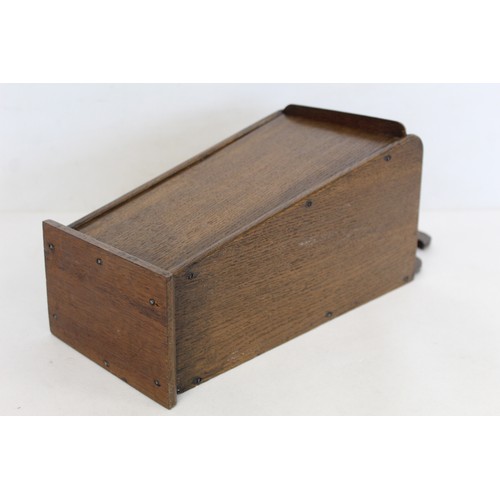 207 - Georgian oak hanging candle box of tapered rectangular form with fret cut pierced back and sliding l... 