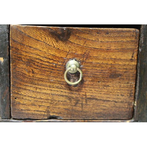 208 - Small Georgian oak hanging cupboard of rectangular form, the panelled door opening to reveal three s... 