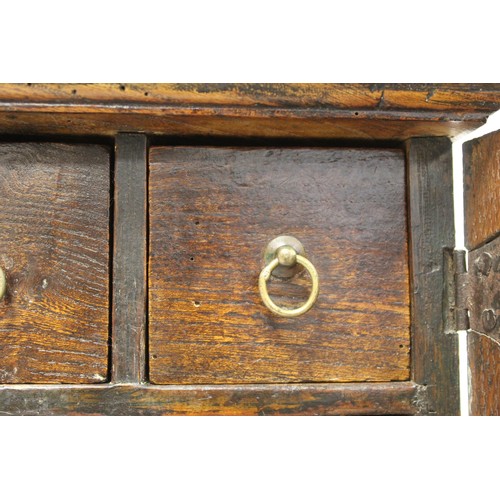 208 - Small Georgian oak hanging cupboard of rectangular form, the panelled door opening to reveal three s... 