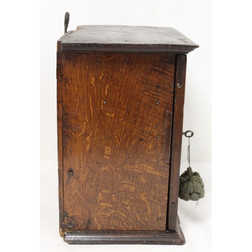 208 - Small Georgian oak hanging cupboard of rectangular form, the panelled door opening to reveal three s... 