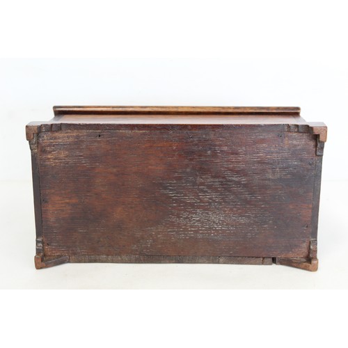 211 - Georgian oak candle box of rectangular form with fret cut pierced back, sloping hinged lid, inlaid s... 