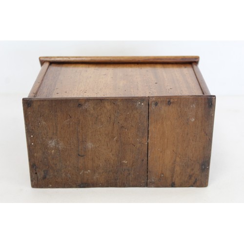 212 - 19th century treen candle or salt box of rectangular form with shaped back and sloping hinged cover,... 