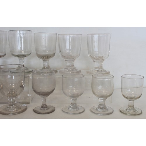 215 - Collection of fourteen antique drinking glasses with rounded bucket bowls on plain stems and circula... 