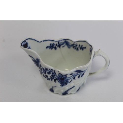 219 - Lowestoft porcelain cream boat c.1764 of low Chelsea ewer form with underglaze blue decoration of da... 