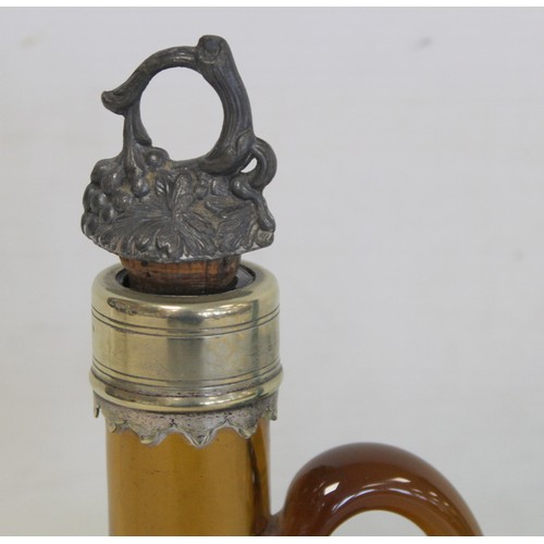 222 - Early 19th century amber glass decanter of globe and shaft form with single scroll handle and metal ... 