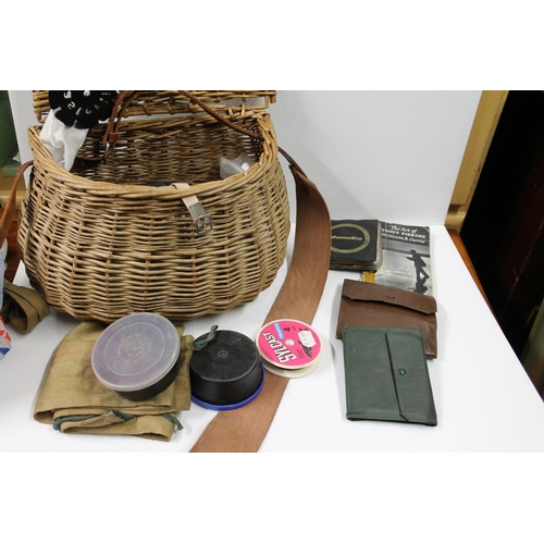 113 - Wicker fishing basket containing fishing tackle including fly wallets, etc.&nbsp;
