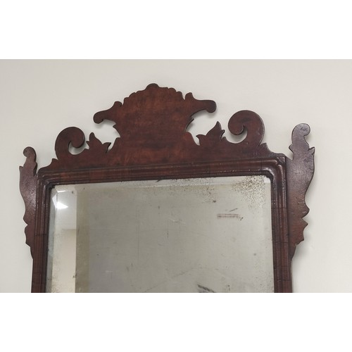 619 - Georgian mahogany fret frame wall mirror, shaped top, bevelled plate and moulded frame. 105cm