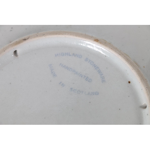 19 - Highland Stoneware pottery wall plate, 26cm diameter.
