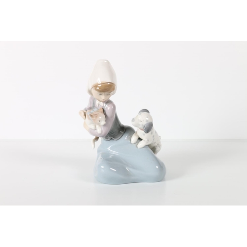 2 - Lladro figure of a woman holding a cat and a dog alongside.