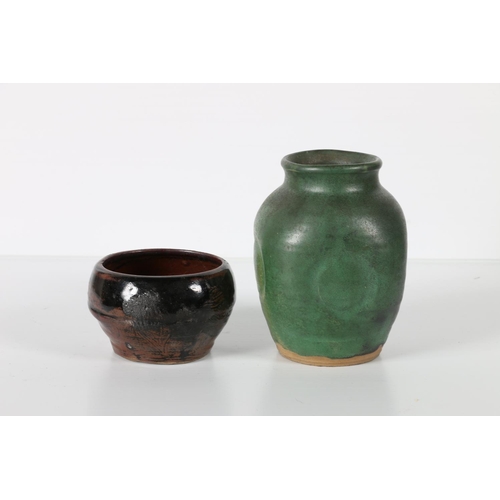 23 - Studio pottery green glazed vase with combed base, unsigned, 14cm tall and a tenmoku glazed sugar bo... 