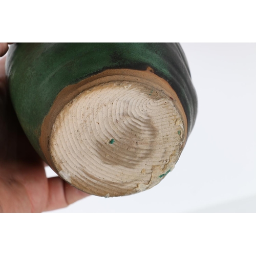 23 - Studio pottery green glazed vase with combed base, unsigned, 14cm tall and a tenmoku glazed sugar bo... 