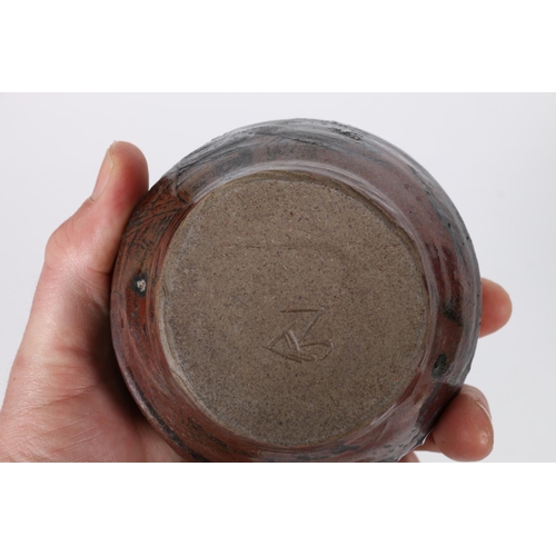 23 - Studio pottery green glazed vase with combed base, unsigned, 14cm tall and a tenmoku glazed sugar bo... 