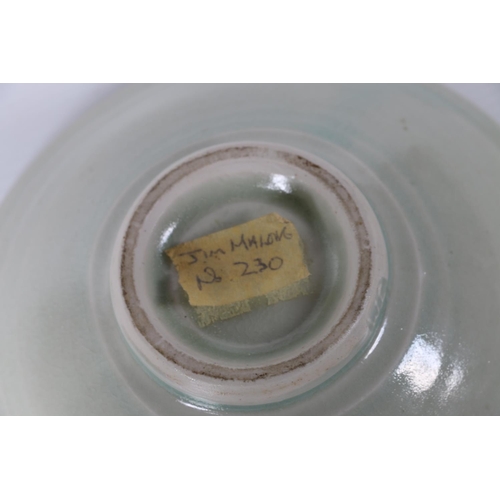 24 - Jim Malone studio pottery celadon ground bowl, JM mark to foot rim, 16cm diameter.