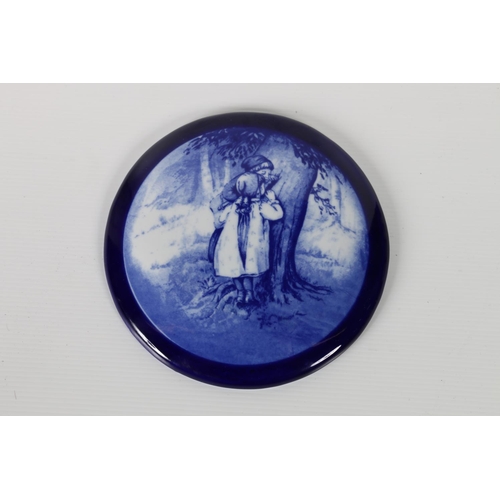 40a - Doulton Burslem style round plaque, flow blue 'Babes in the Wood' central image, with cobalt border,... 