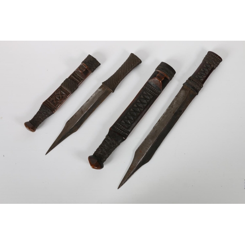 43 - Two African daggers with wire bound chip carved sheaths, 40cm and 32cm long, (2).