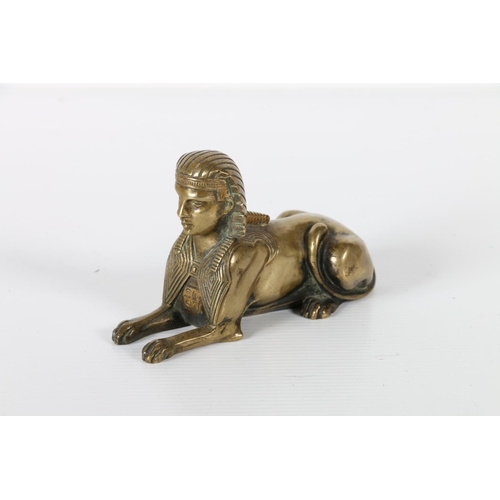 48 - Cast bronze model of Sphinx, 12cm long.
