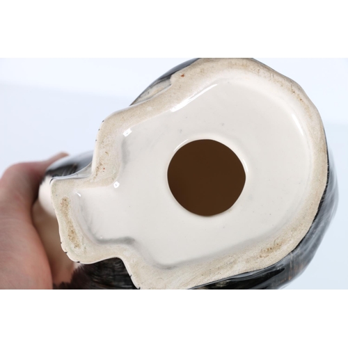 8 - Porcelain model of a cat in the manner of Babbacombe Pottery or Winstanley, 22cm tall.