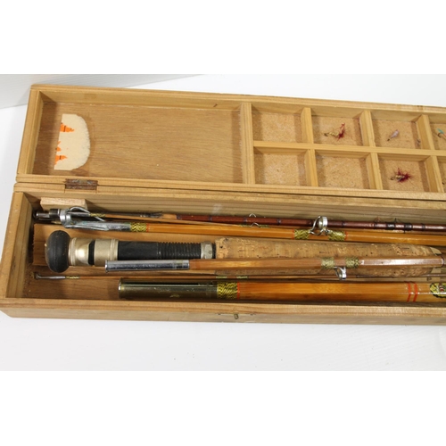 128 - Vintage split cane fishing rods in wooden case