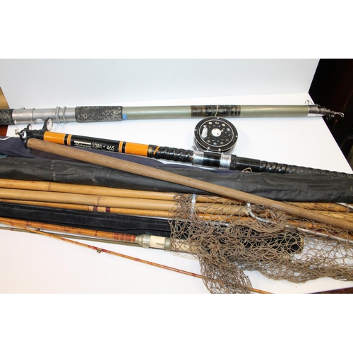 129 - A group of fishing rods including Shakespeare 1081-465 telescopic, Alcocks duraglass, etc. also a la... 
