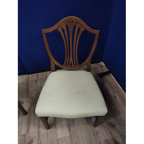 613 - Hepplewhite style mahogany elbow chair with matching side chair, shield shaped top above a wheatshea... 