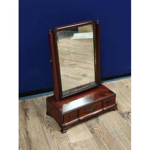 615 - Georgian mahogany dressing glass, the swing mirror above a central drawer flanked with a small drawe... 