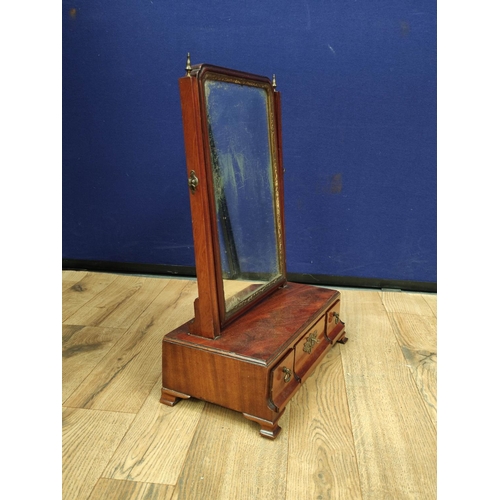 615 - Georgian mahogany dressing glass, the swing mirror above a central drawer flanked with a small drawe... 