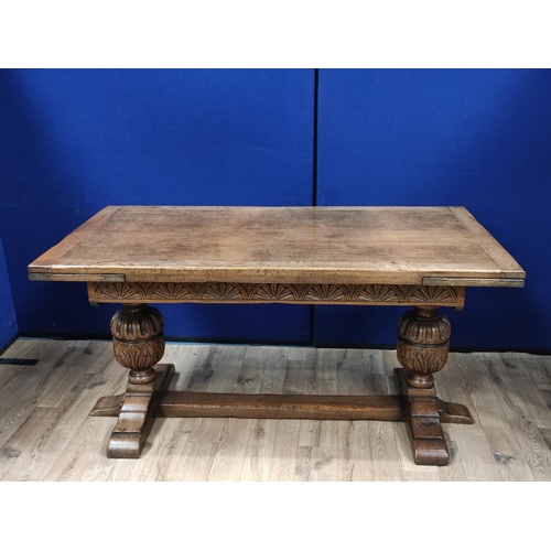 616 - Oak refectory draw leaf dining table, the draw leaf plank top above a carved frieze, raised on carve... 