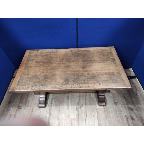 616 - Oak refectory draw leaf dining table, the draw leaf plank top above a carved frieze, raised on carve... 