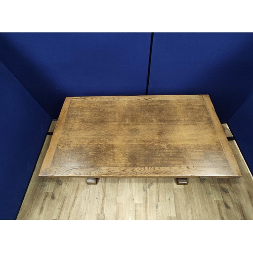 616 - Oak refectory draw leaf dining table, the draw leaf plank top above a carved frieze, raised on carve... 