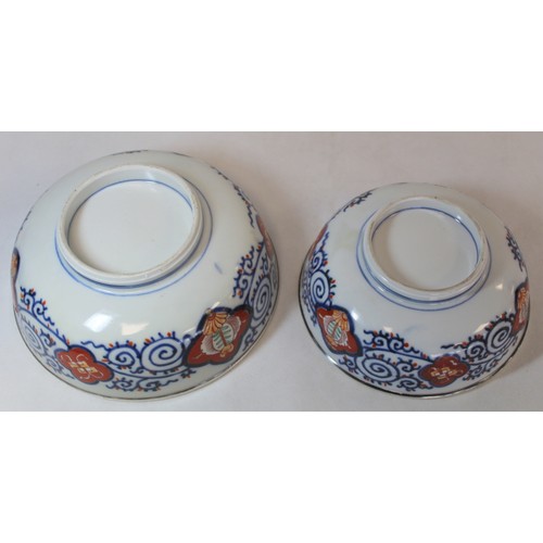 252 - Graduated pair of Japanese Imari bowls with panels of flowers and mythical creatures and silver rims... 