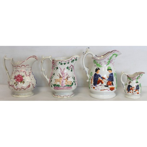 256 - Victorian graduated pair of Staffordshire moulded jugs depicting children playing cards, with pink l... 