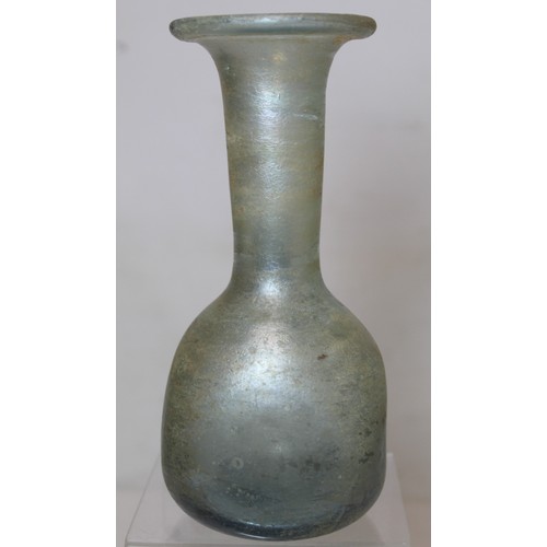 261 - Antique glass flask or ewer, possibly Roman, the flattened globular base with tall flared neck, fold... 