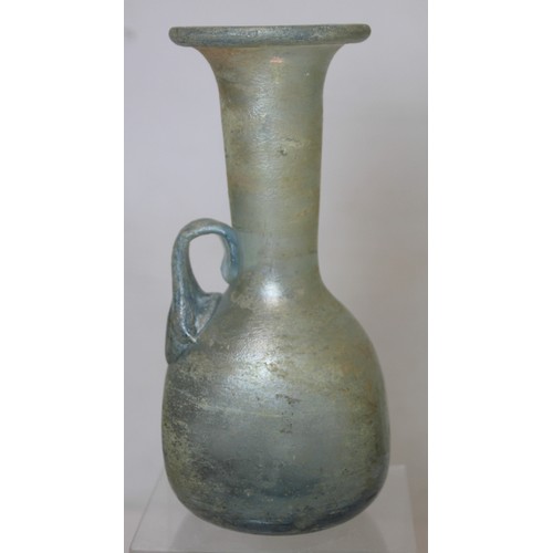 261 - Antique glass flask or ewer, possibly Roman, the flattened globular base with tall flared neck, fold... 