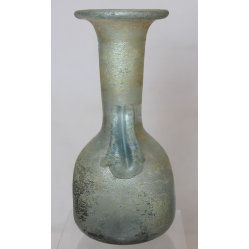 261 - Antique glass flask or ewer, possibly Roman, the flattened globular base with tall flared neck, fold... 