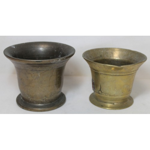 264 - Antique bronze mortar of flared circular form, 15cm diam. and another smaller, 13.5cm diam.  (2).