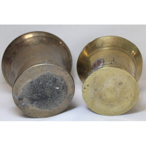 264 - Antique bronze mortar of flared circular form, 15cm diam. and another smaller, 13.5cm diam.  (2).