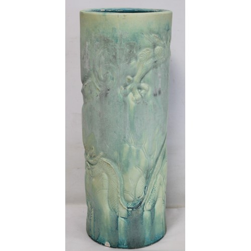 265 - Large Bretby pottery cylindrical stick stand with moulded matt green drip glazed decoration of two s... 