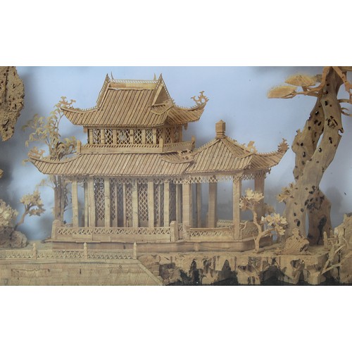 266 - Chinese carved cork diorama depicting a pavilion on a lake with trees and cranes, contained in eboni... 