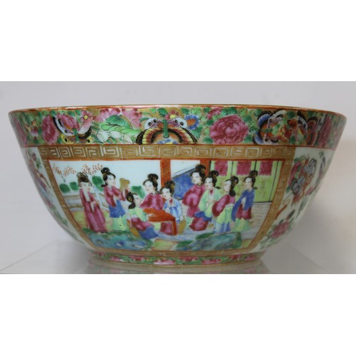 269 - 19th century Chinese Canton famille rose circular punch bowl, decorated with panels of figures on te... 