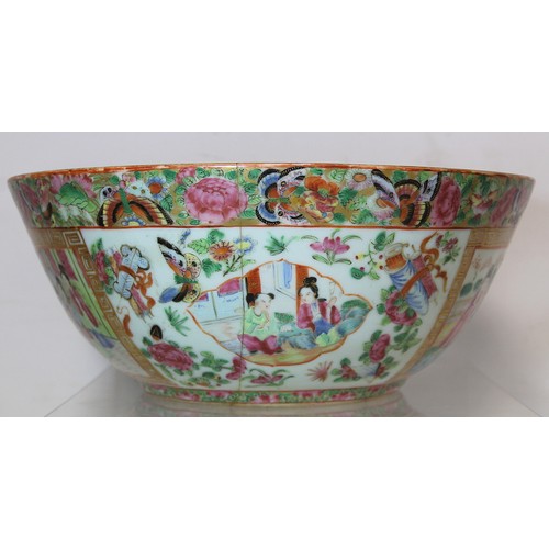 269 - 19th century Chinese Canton famille rose circular punch bowl, decorated with panels of figures on te... 