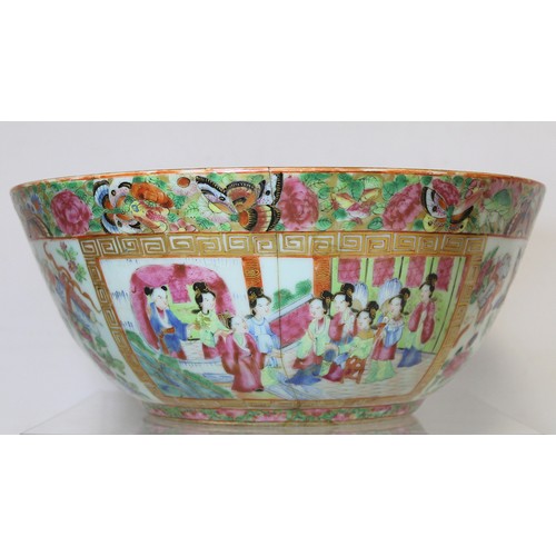 269 - 19th century Chinese Canton famille rose circular punch bowl, decorated with panels of figures on te... 