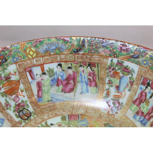 269 - 19th century Chinese Canton famille rose circular punch bowl, decorated with panels of figures on te... 