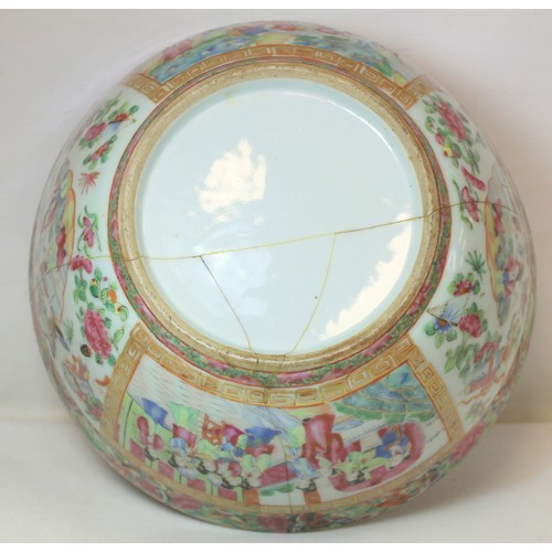 269 - 19th century Chinese Canton famille rose circular punch bowl, decorated with panels of figures on te... 