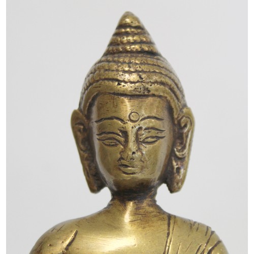 274 - Eastern bronze figure of a Buddha seated on a lotus throne, hollow base, 15cm high.